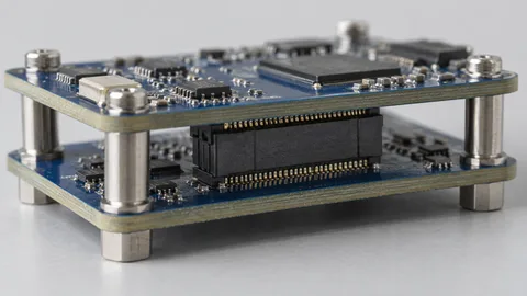 Illustration of stacked circuit boards with a mezzanine connector and mechanical supports